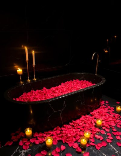 Black marble bath with rose petals