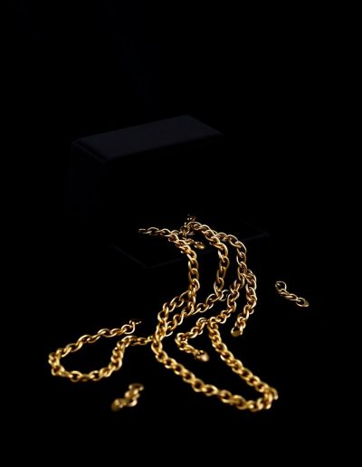 Gold chain on black velvet